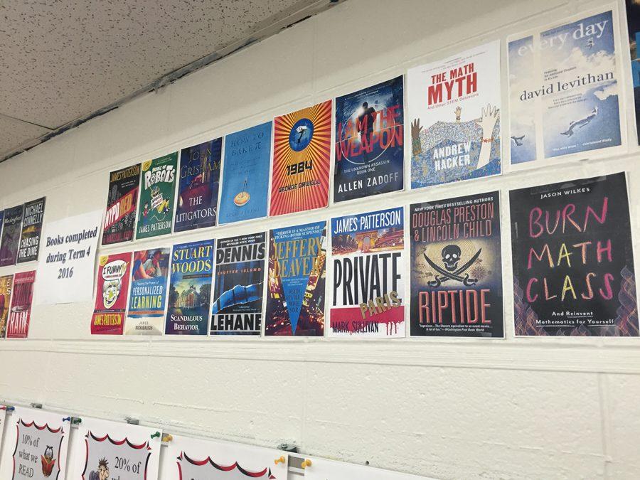 Math Teacher Jeff Harding keeps track of the books hes read on a book wall in his room. These are just some of the books hes read in term four.