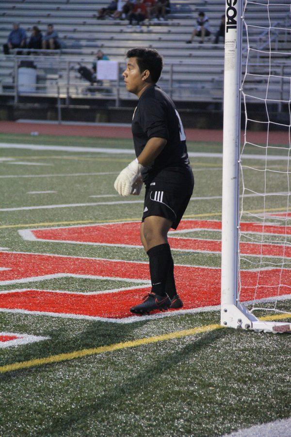 Senior Eric Muniz sets in goal, watching the game so hes ready for a shot.