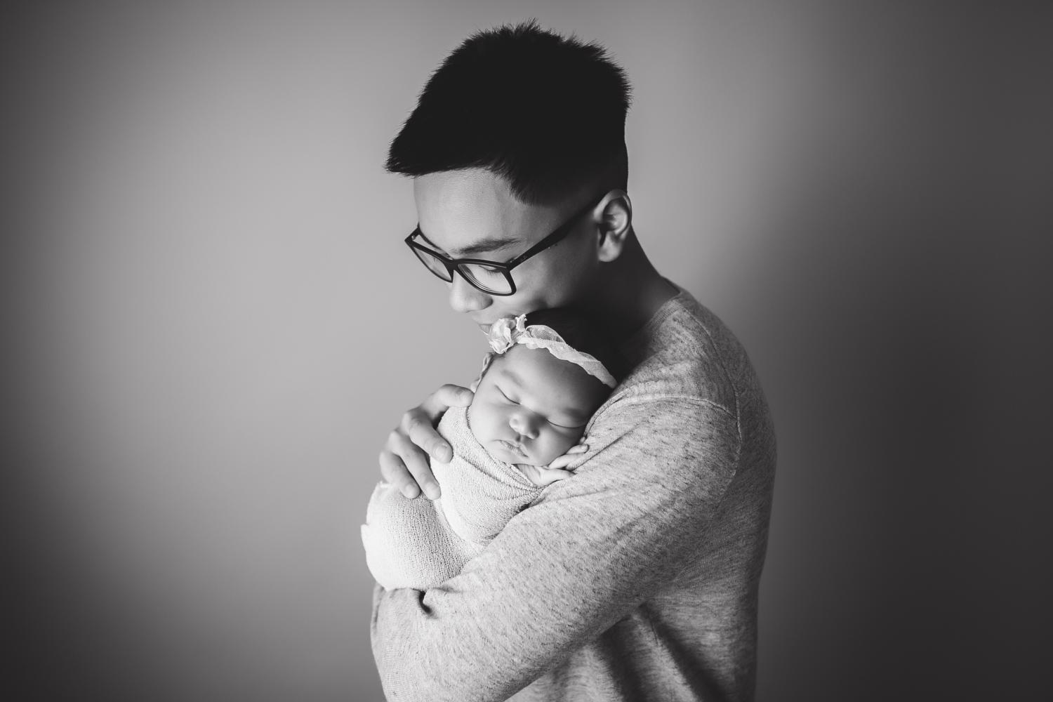 Michael del Rosario, posing with baby sister, will attend Northwestern University, majoring in journalism and computer science.