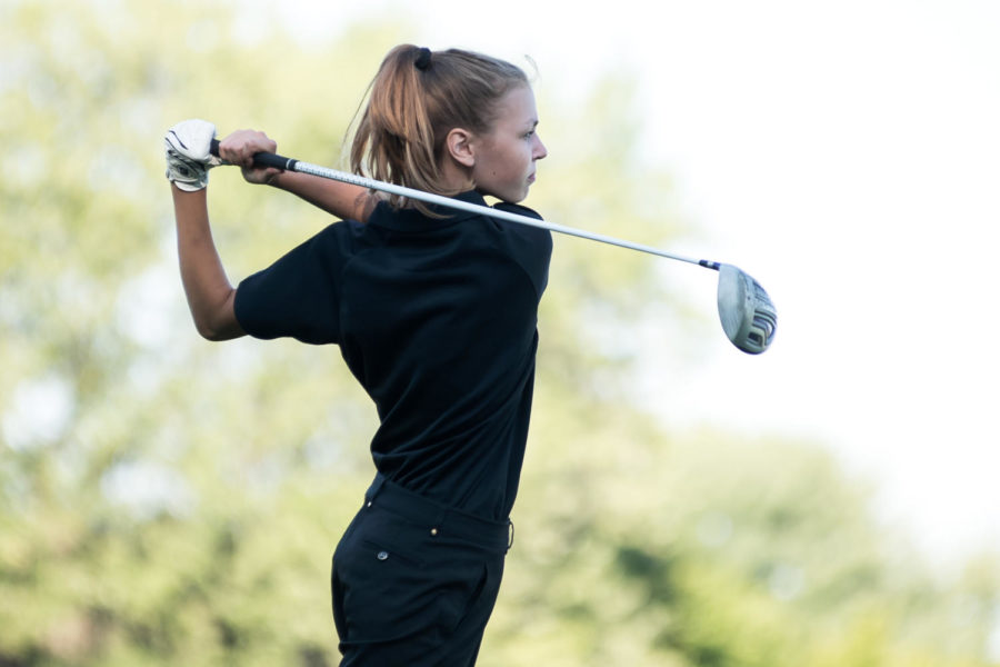 Freshman Natalie Altenhoff finishing her swing at a recent golf meet.