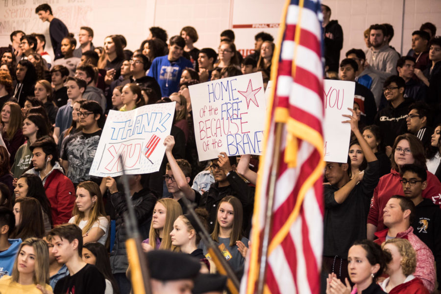 During the Nov. 9 assembly, students brought signs to raise up as the veterans entered the gym. The signs were meant to show student support for the various branches of the armed forces. 