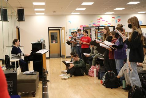 “The Addams Family” cast members work on the music for the spring musical with Choir Director Stevee Bellas on Thursday, March 10.