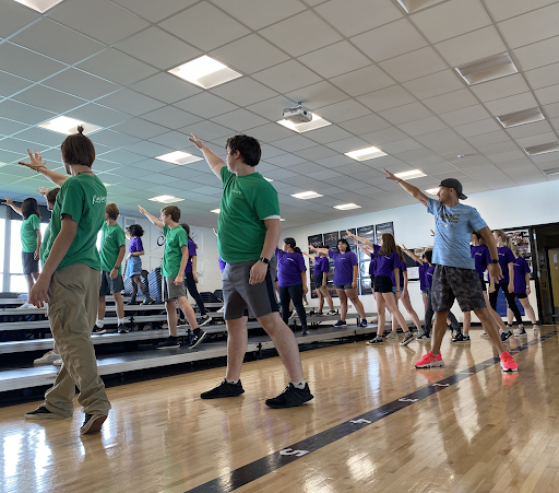 Dancing to a new chapter: The first ever choreography day for Reverb. Being taught by choreographer Ben Schrank (right), Reverb learns some moves for their show that they will compete later in the year. “Through just starting and doing choreography and listening, I think we sound and dance really well,” said Senior Erin Prinzing. “And we’re remembering pretty well as well.”