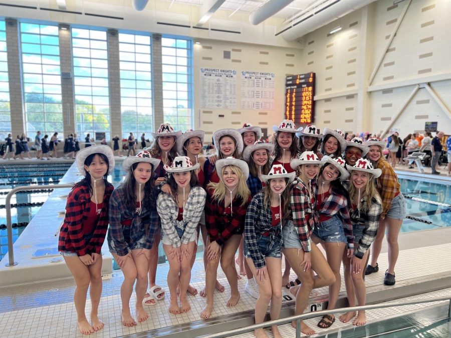 The+Girls+Varsity+Swim+and+Dive+team+at+the+October+8+Hersey+Jamboree%2FRob+Lindgren+Invite.+Before+they+compete+at+the+invite%2C+every+team+participates+in+a+two+minute+dance+routine+judged+by+the+boys+on+the+Hersey+Homecoming+Court.+The+Mustang+swimmers+won+the+dance+competition+with+their+country+mashup+routine.