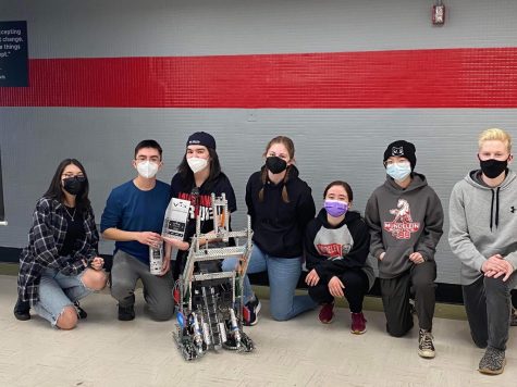 Robotics team 499M winning an award during their 2021-2022 season. “My favorite part of robotics is the hands-on building,” Senior Caleb Beversdorf said. “It’s always fun putting together the bot and seeing your plans become reality.”