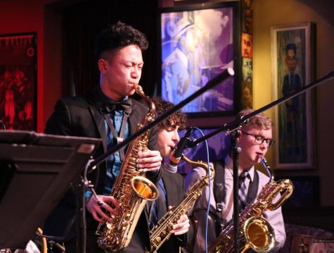 Senior Neil Martin playing a solo during the song “Caravan” while Senior Will Gonzalez and Sophomore Aidan Ross accompany him during the band’s Feb. 22 performance at the Chicago Jazz Showcase. The song, composed by Duke Ellington, is famous for being featured in the 2014 film “Whiplash.”