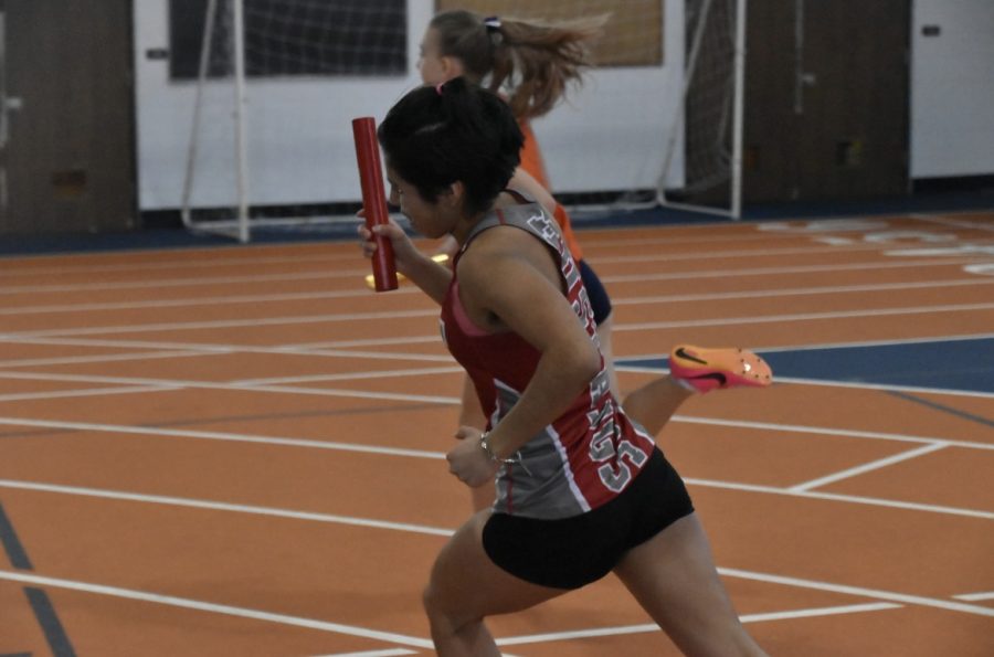 Sophomore+Vivi+Gonzalez+running+the+4x800+meter+relay+race+during+the+Feb+18+track+meet+at+Buffalo+Grove+High+School.+Gonzalez+also+ran+the+open+800+meter+race+and+the+4x400+meter+relay+race.+Said+Gonzalez%2C+%E2%80%9CI+don%E2%80%99t+know+my+favorite+part+of+track+because+I+think+there%E2%80%99s+a+lot+I+think+about+when+it+comes+to+track.+I+think+about+the+community+of+runners%2C+my+personal+goals%2C+the+reason+for+why+I+run%2C+the+adrenaline+rush+%28combination+of+excitement+and+nervousness%29%2C+how+inspired+I+get+by+other+runners%2C+because+I%E2%80%99m+an+addict+to+this+sport.%E2%80%9D