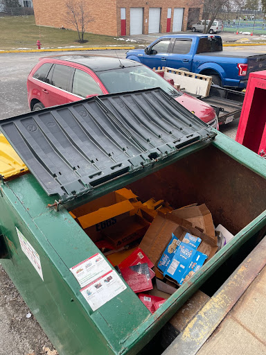 This dumpster contains solely paper products for recycling.