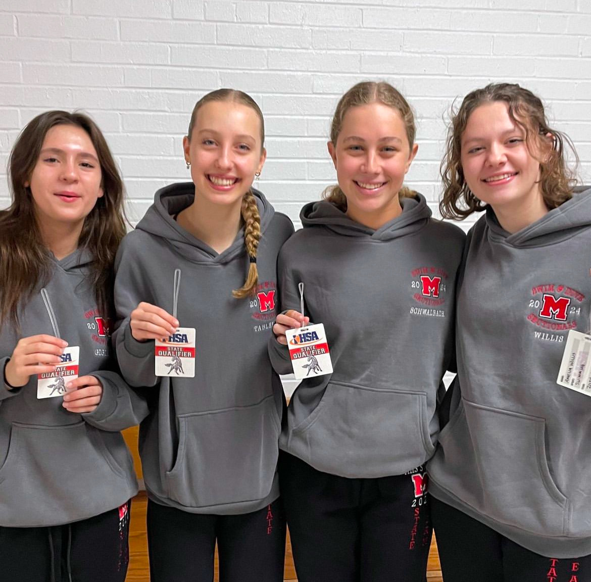 Pictured above (left to right) are Gracyn Gigiano, Lauren Tableman, Karina Schwalbach, and Amelia Willis  receiving their state qualifier tags after competing at sectionals. Photo courtesy of @mundeleinhighschool on IG